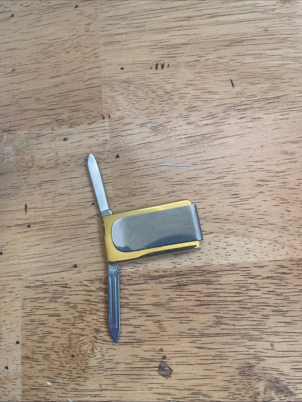 Gold-Tone Ship Engraved Money Clip with knife and file.